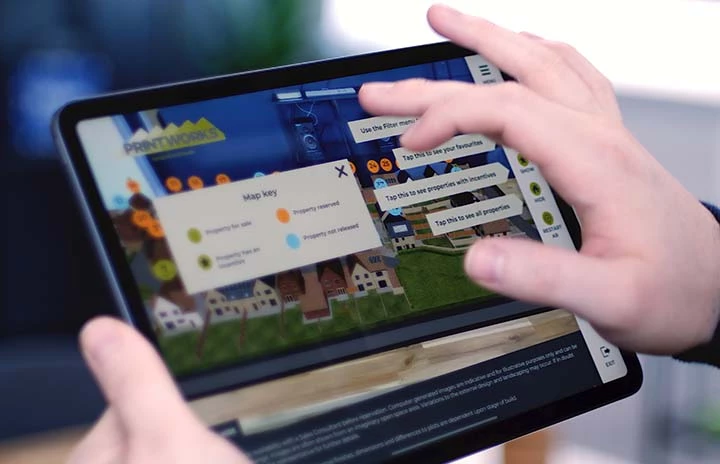 An ipad using the AR camera to view a housing development