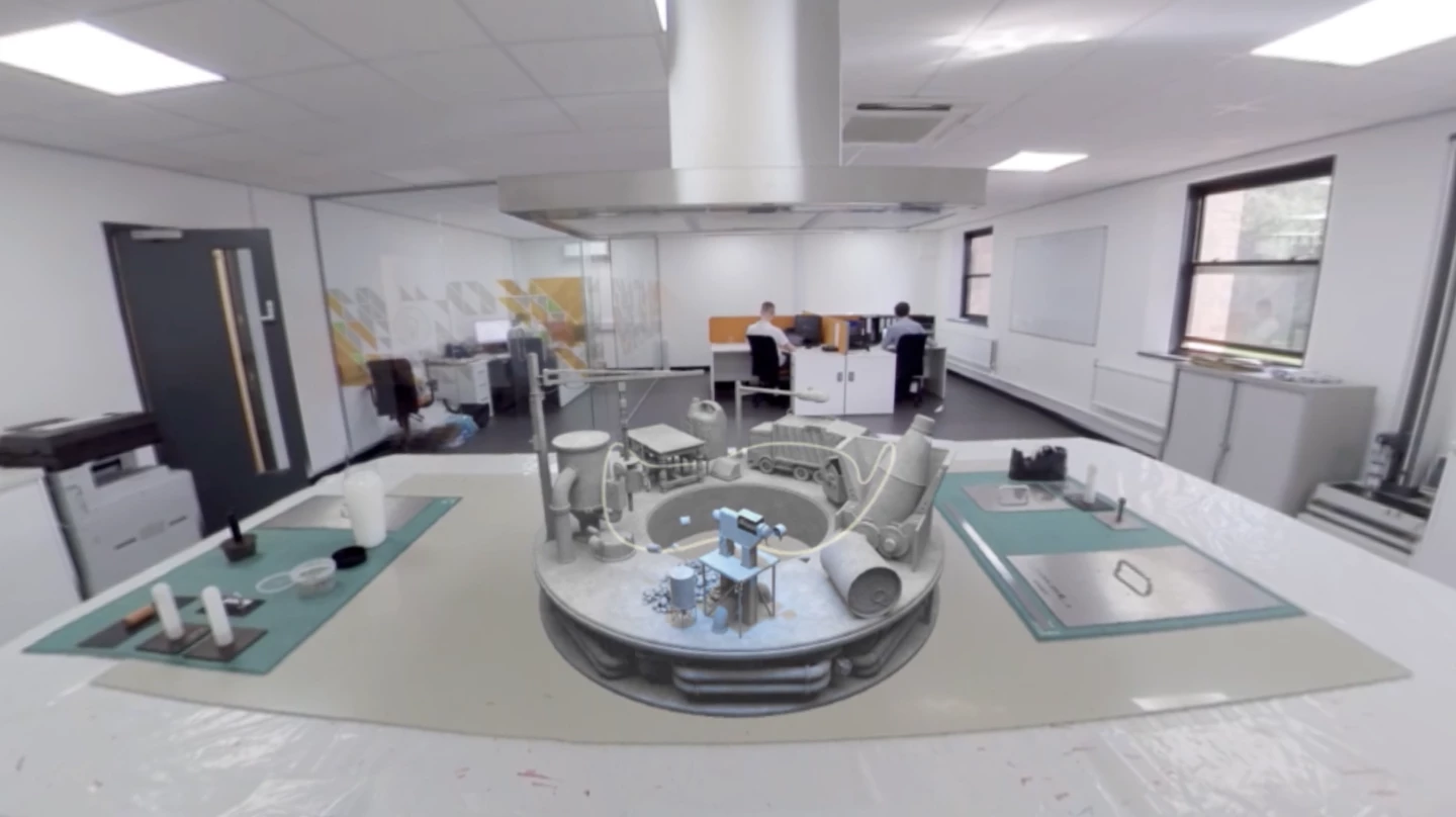 a science lab with a 3d model of a recycling plant on the desk