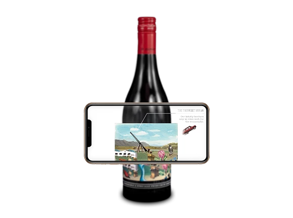 A wine bottle with a phone placed over the label to activate an Augmented Reality game