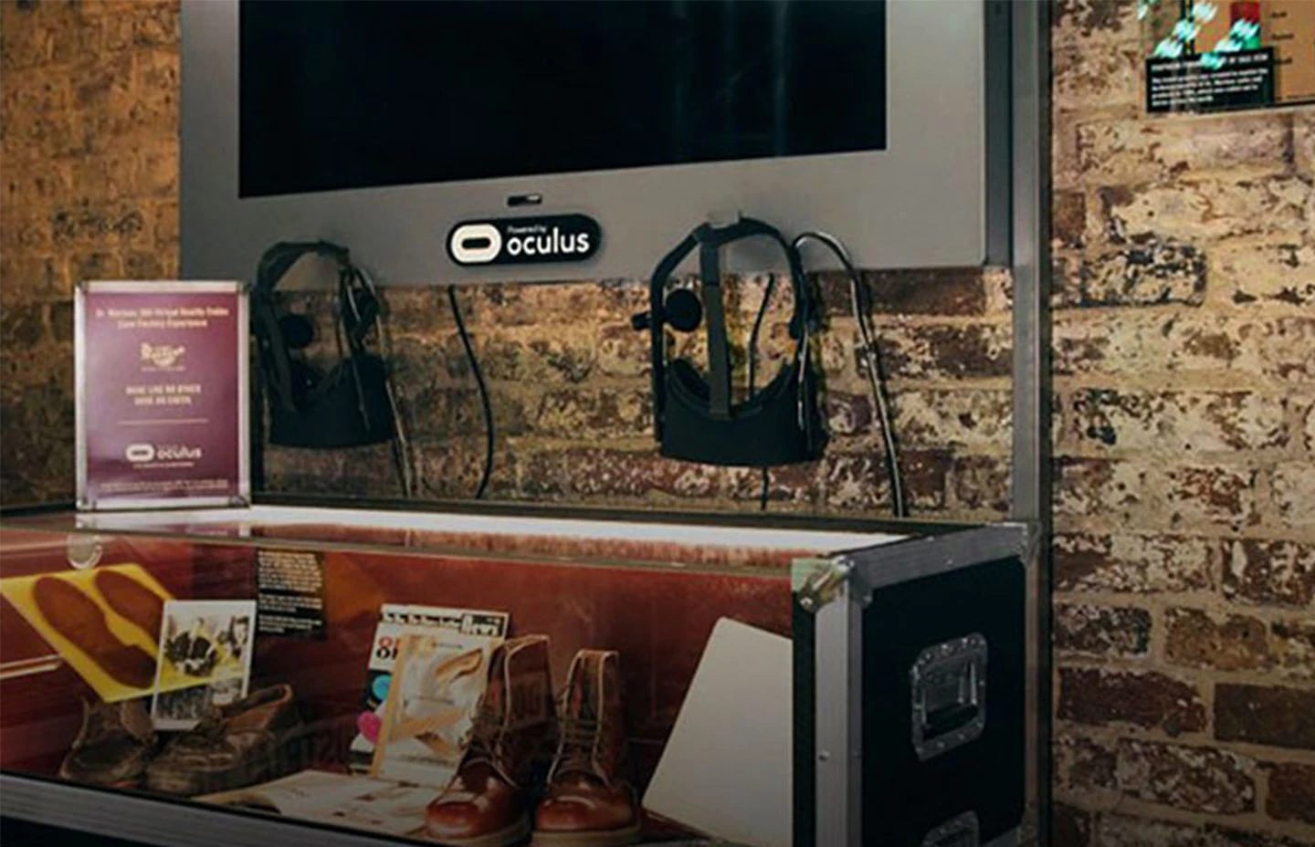 Oculus television and headsets hanging above a shelf of Dr Martens memorabilia