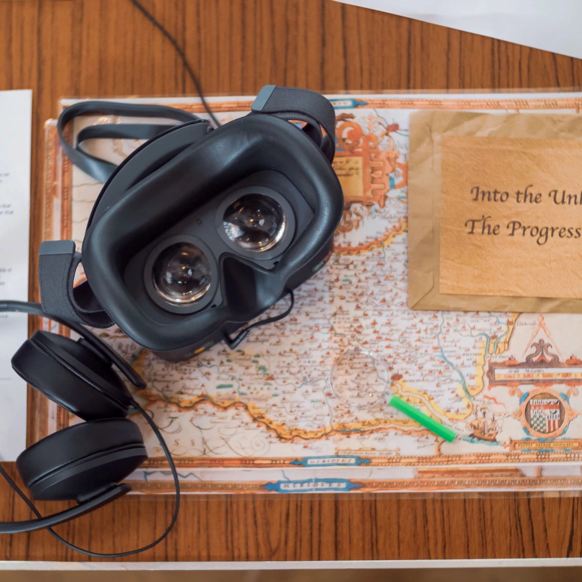 A Virtual Reality Headset on top of an old map of Norfolk