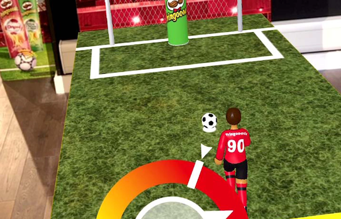 Screenshot of football player avatar running to shoot a penalty with strength meter on screen