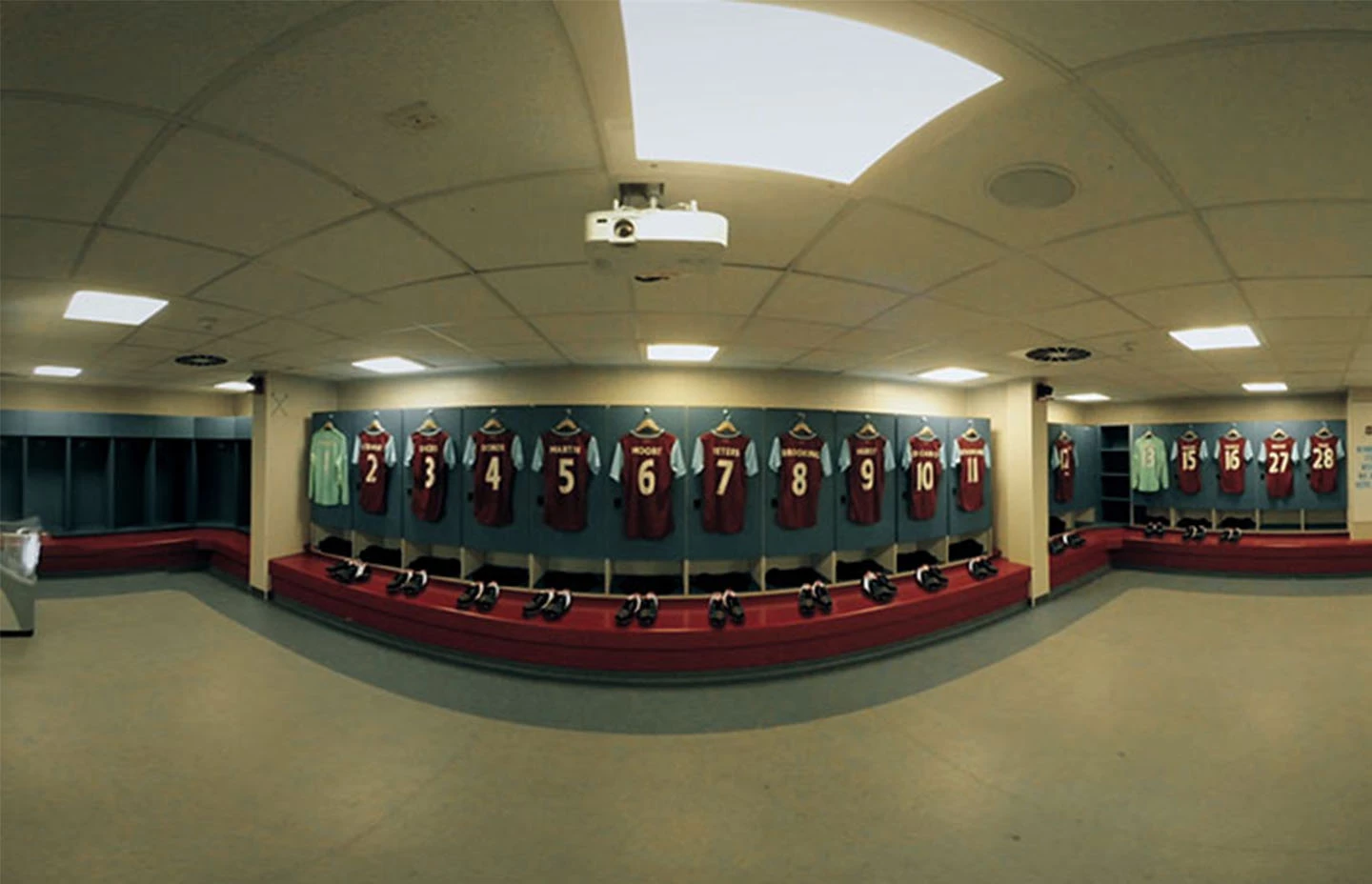 West Ham United changing room with football kits hung on the walls