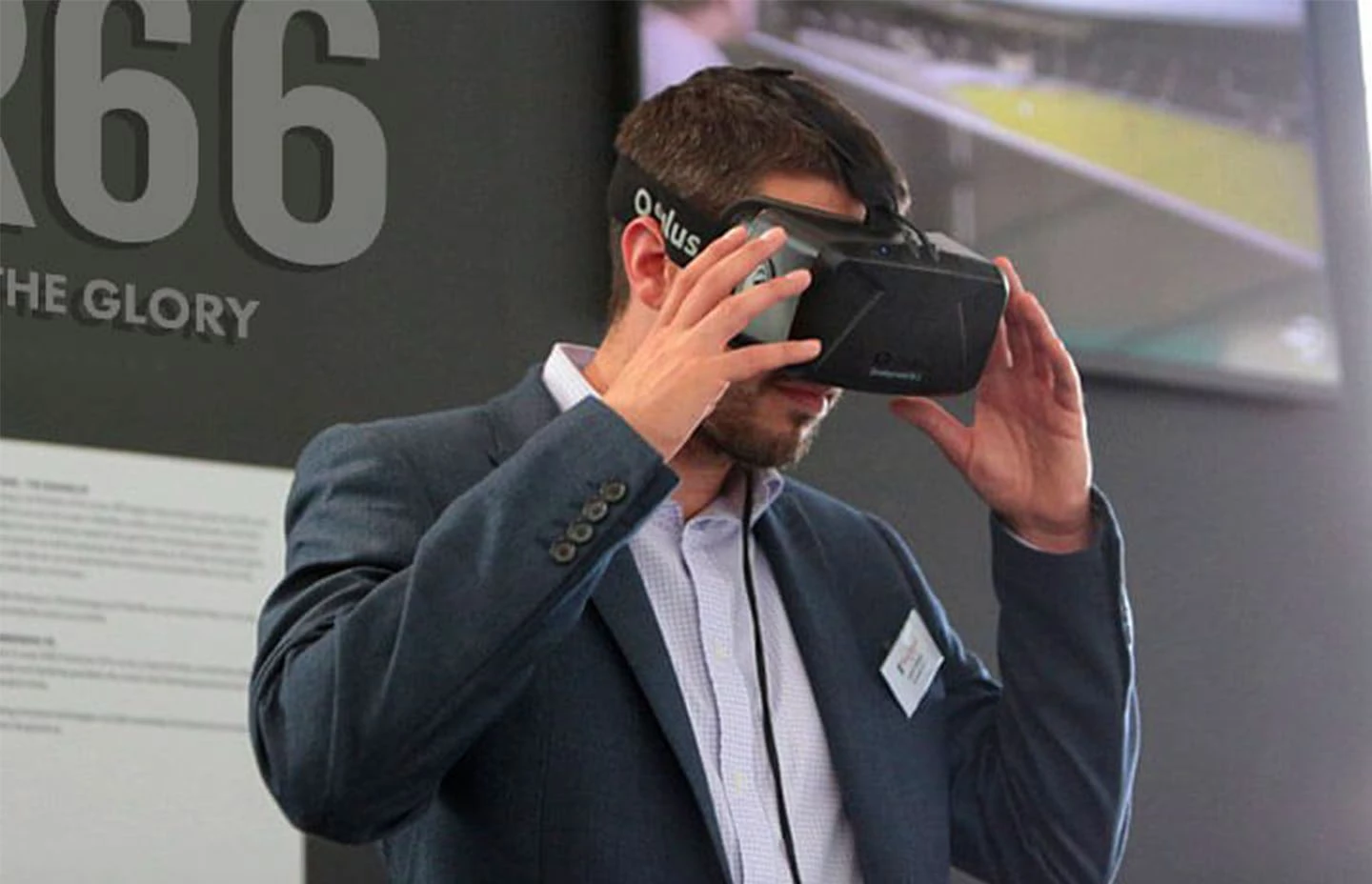 Man wearing Oculus VR headset watching a football experience