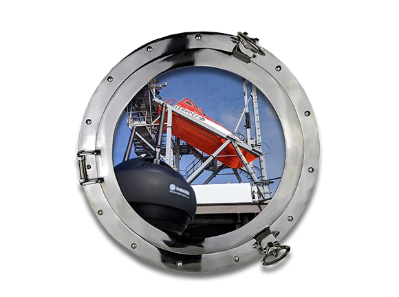 a porthole looking at a lifeboat