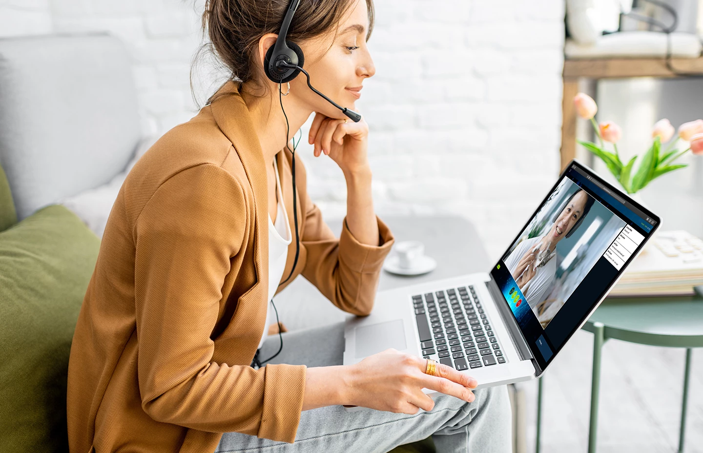 a woman wearing a headset on a video call