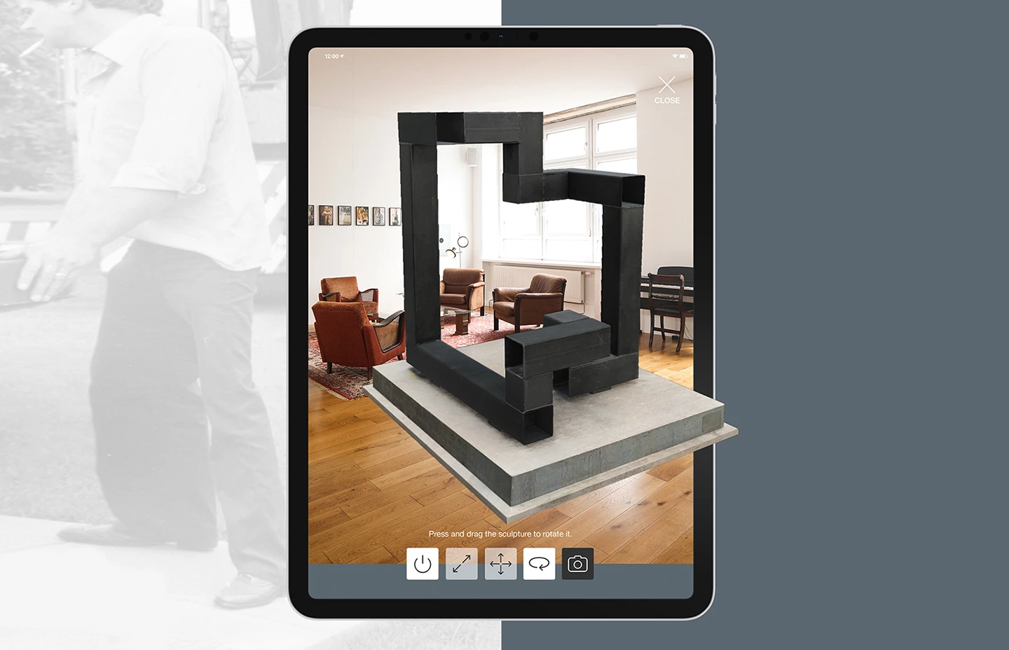 An ipad using the AR camera to view a sculpture