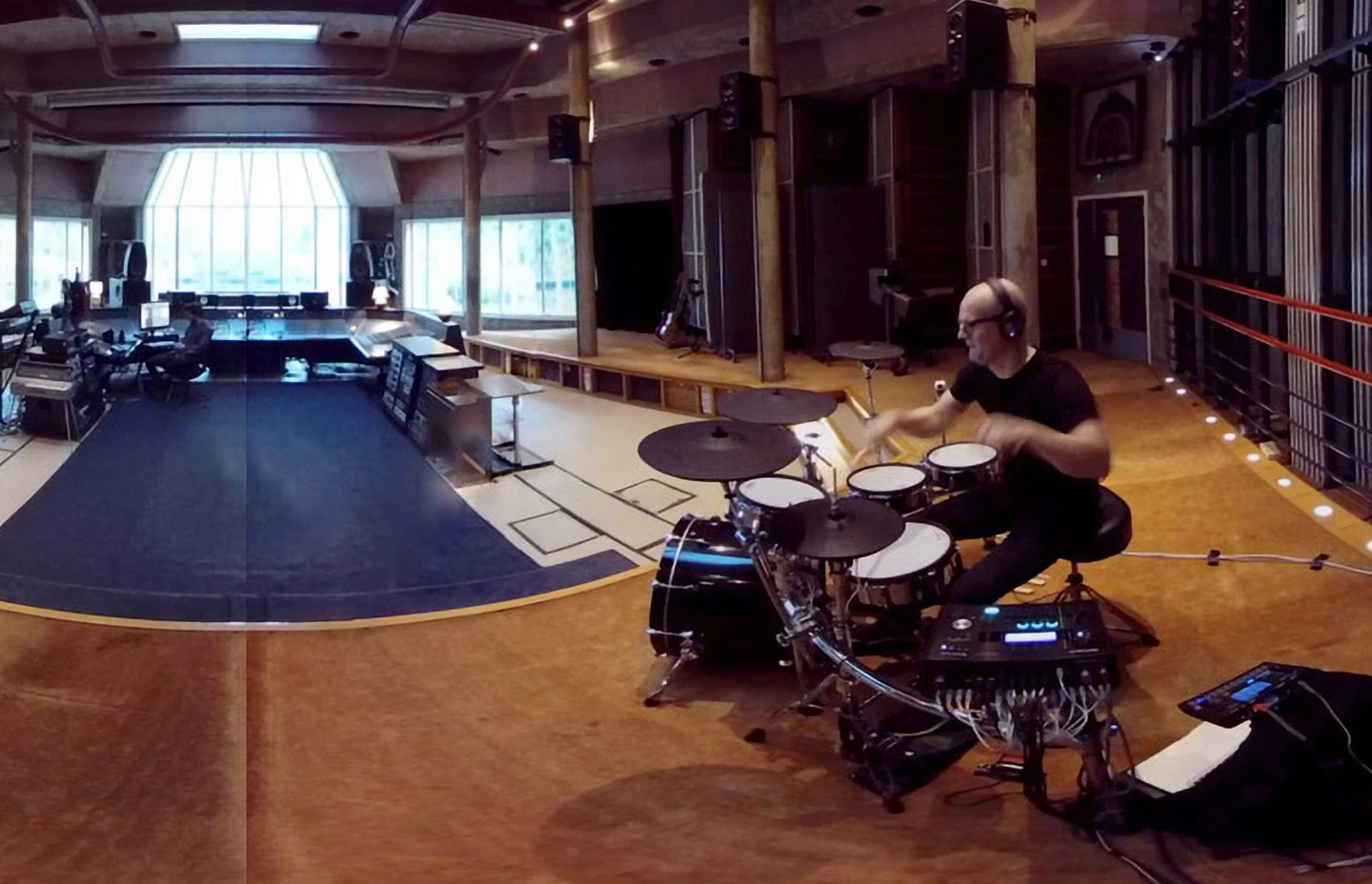 a drummer in a recording studio
