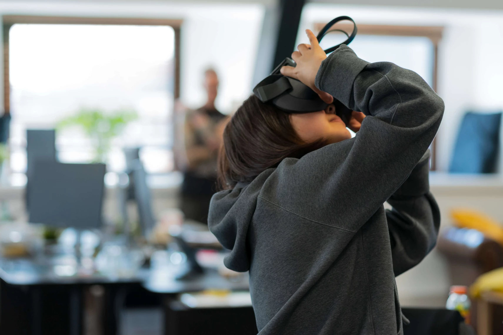 girl holding virtual reality headset