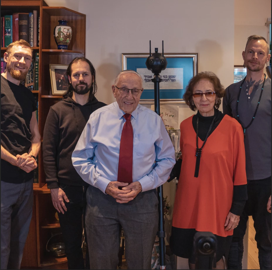 a film crew with a holocaust survivor and his wife