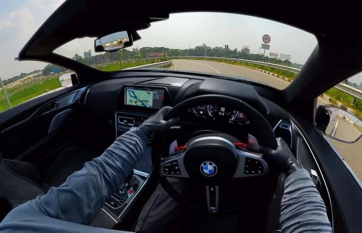 A POV shot of a race driver on a track