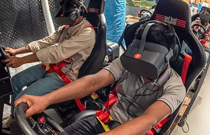 two men in VR driving simulators