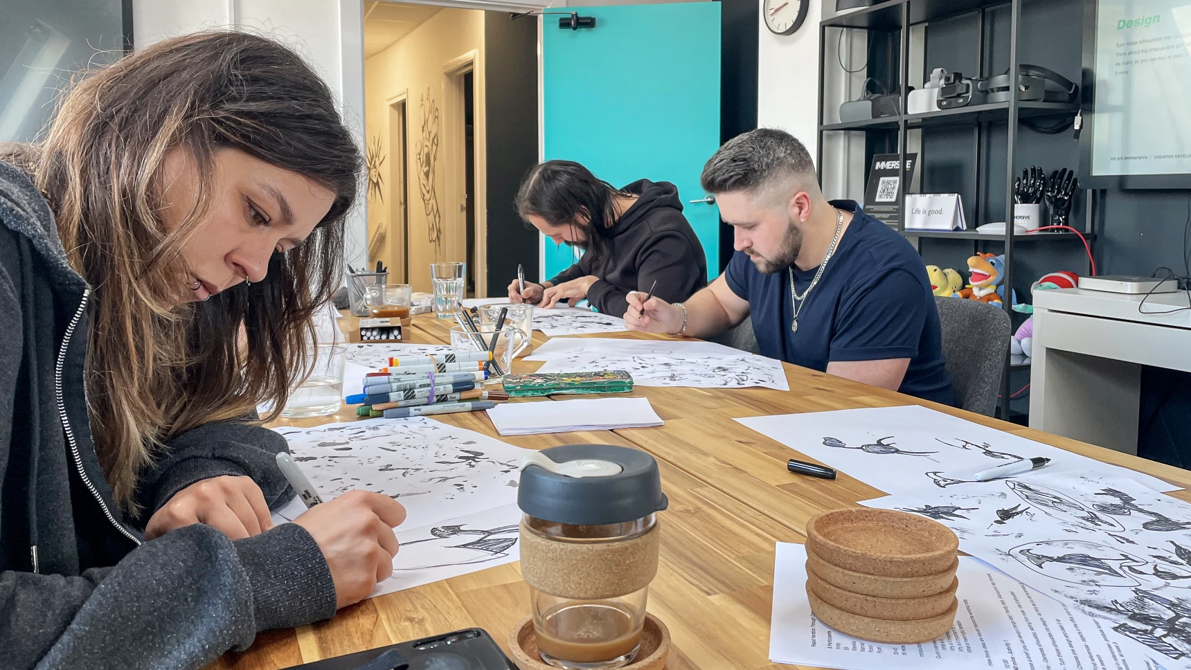 people drawing in a meeting room